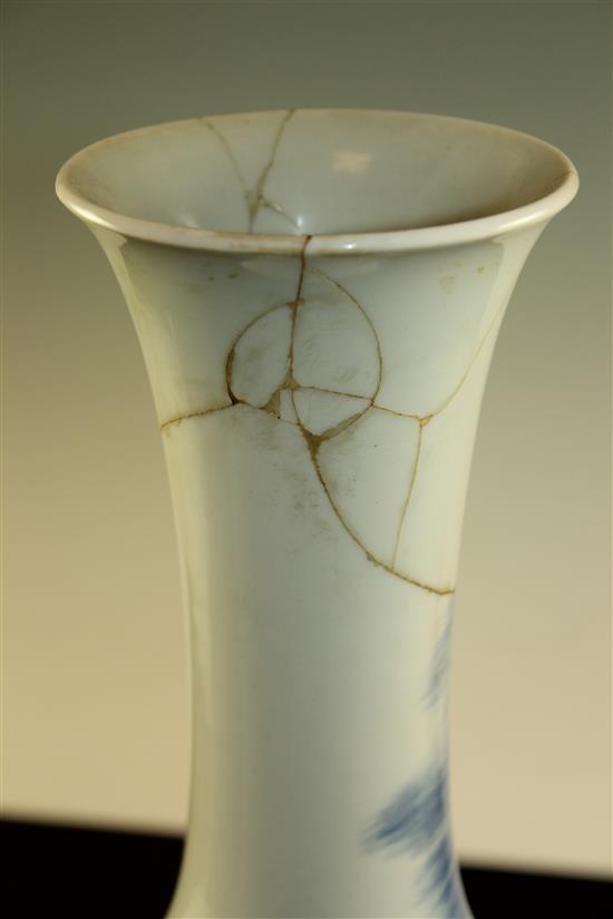 A Chinese underglaze blue and copper red crane and deer bottle vase, Kangxi six character mark, early 20th century, 39.5cm., neck rep